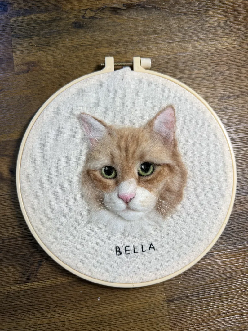 Orange tabby cat Bella, needle felted portrait matted in a white wooden frame